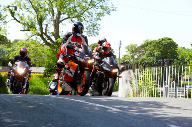 Motorcycles at the iconic Ballaugh Bridge on the famous TT course